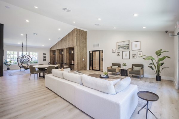 Luxury clubhouse with modern design at Sage at Green Valley Apartments, offering premium amenities and comfortable lounging spaces