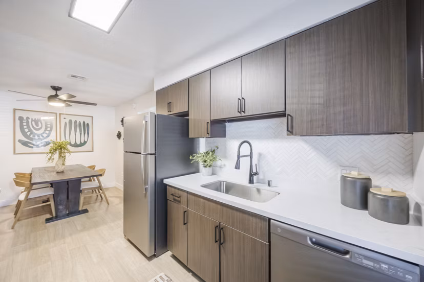Kitchens: Open-plan kitchen and dining area with modern appliances at Sage at Green Valley Apartments