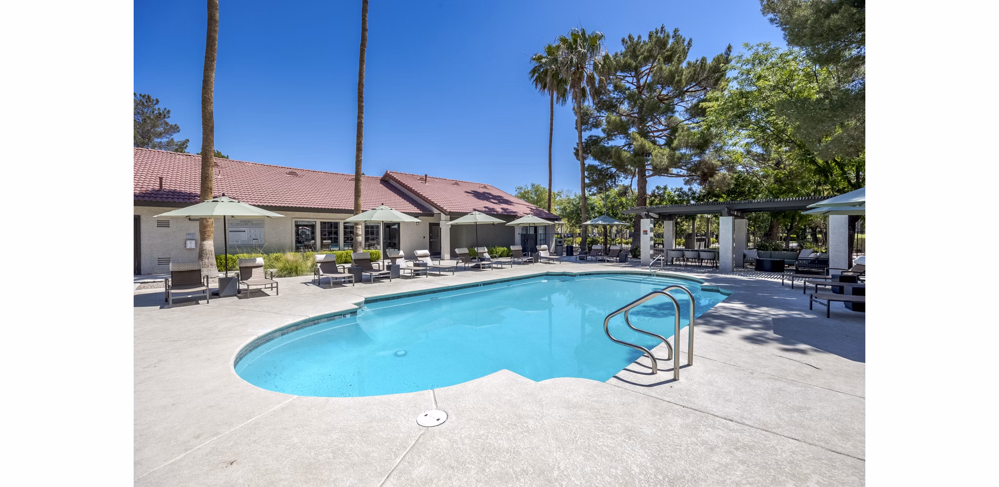 Relaxing poolside oasis at Sage at Green Valley Apartments