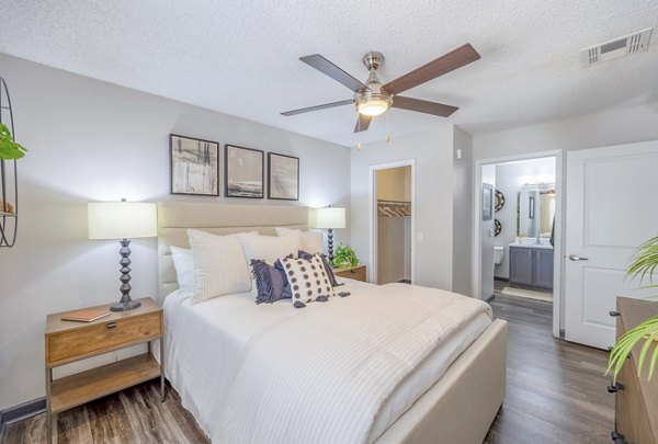 Cozy bedroom with stylish decor at 5400 Vistas Apartments