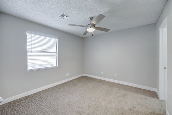 Cozy bedroom with modern design elements at 5400 Vistas Apartments