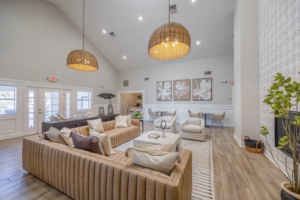 Clubhouse with modern seating and billiards table at 5400 Vistas Apartments, a Greystar luxury community