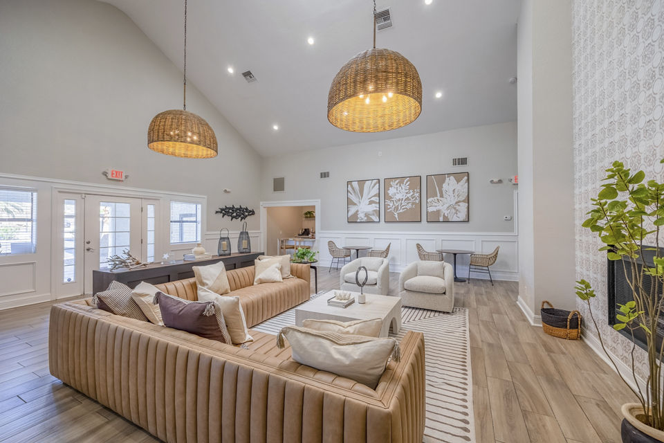 Clubhouse with modern seating and billiards table at 5400 Vistas Apartments, a Greystar luxury community