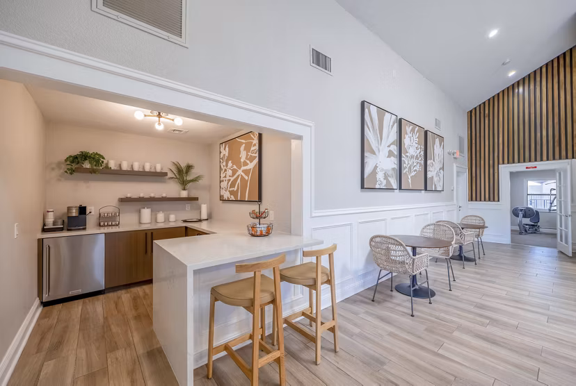 Modern clubhouse with stylish seating and TVs at 5400 Vistas Apartments, a luxury living community offering premium amenities and social spaces