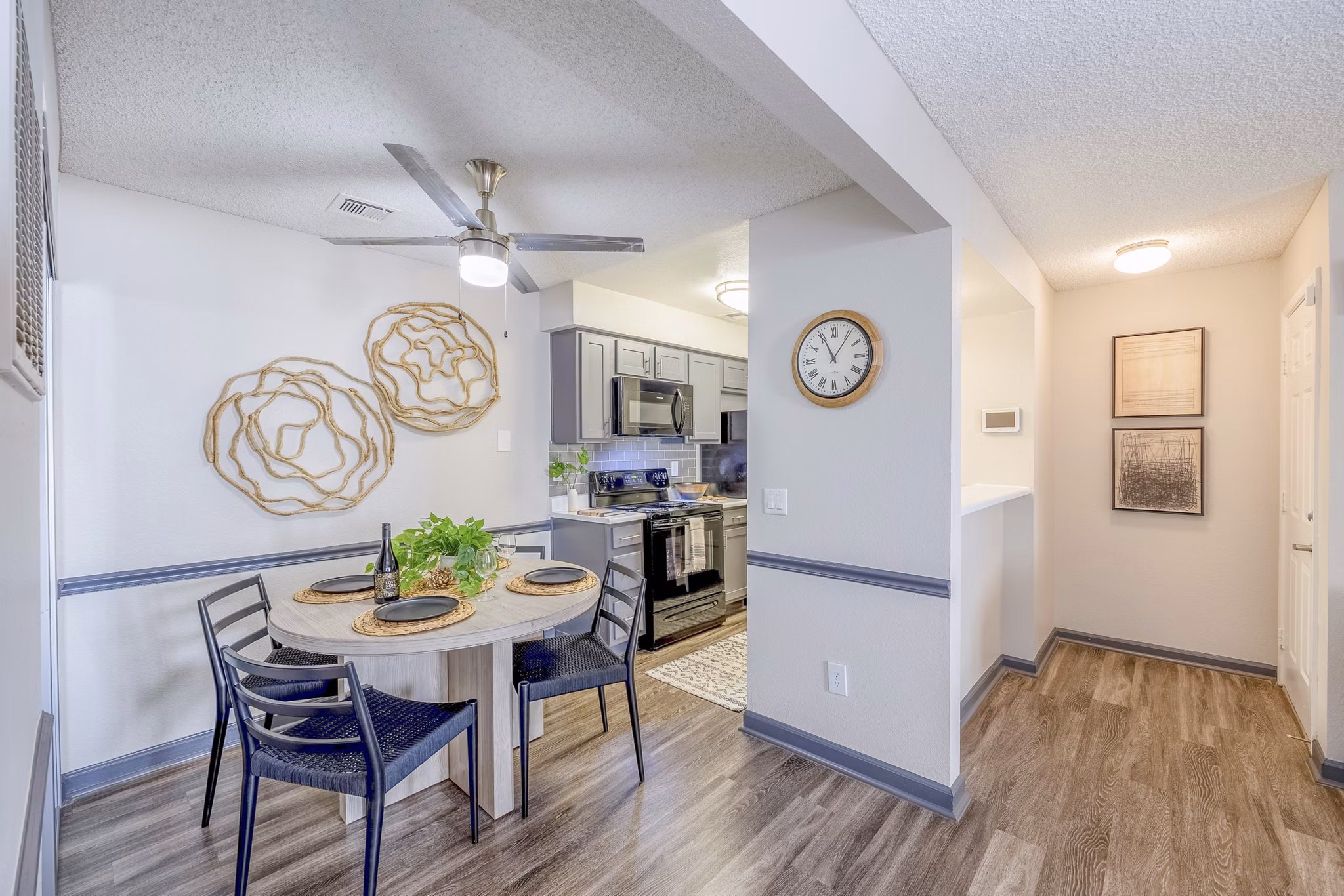 Dining area featuring modern furniture and large windows at 5400 Vistas Apartments luxury rentals