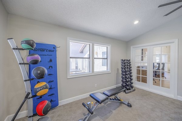 Fitness center with modern equipment at 5400 Vistas Apartments offering residents a comprehensive workout experience