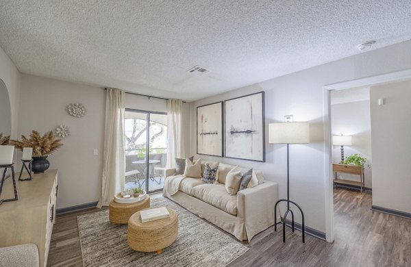 Spacious living room with modern decor in 5400 Vistas Apartments, perfect for luxury living
