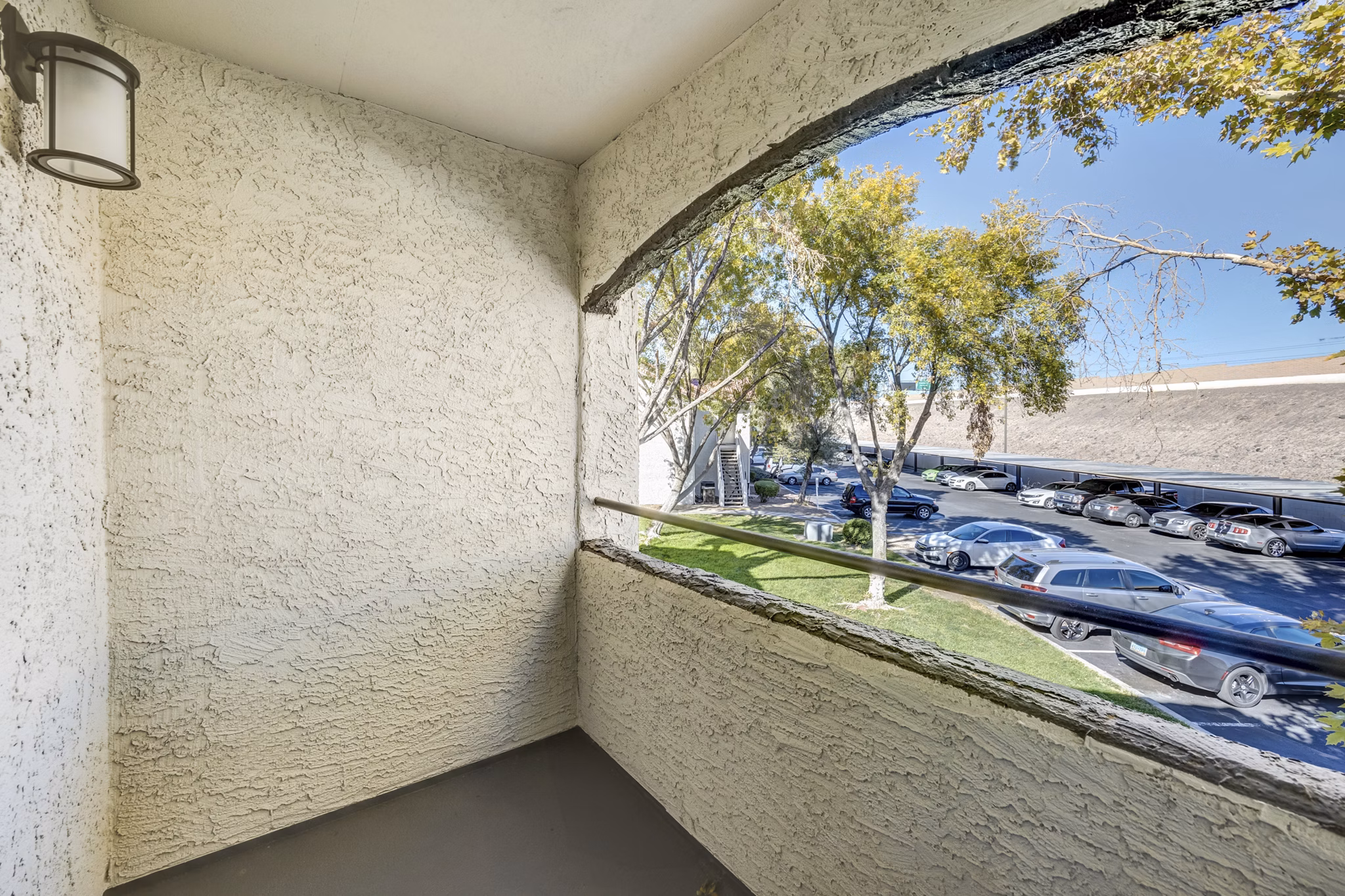 Cozy outdoor patio with seating at 5400 Vistas Apartments, perfect for relaxation and social gatherings