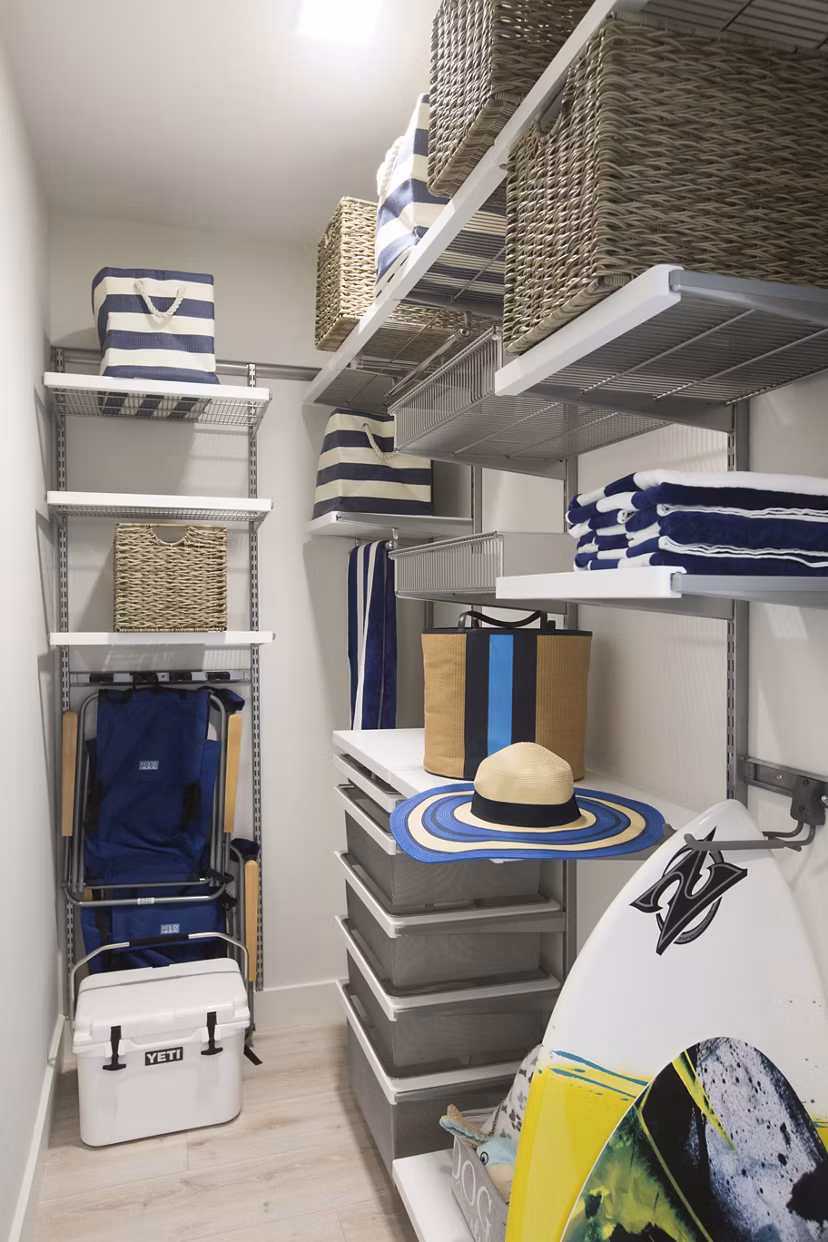 Spacious closet with built-in shelving in One Beachmont Apartments bedroom