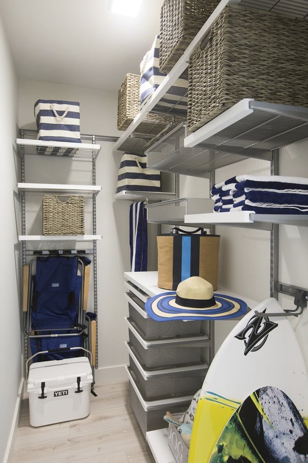 Spacious closet with built-in shelving in One Beachmont Apartments bedroom