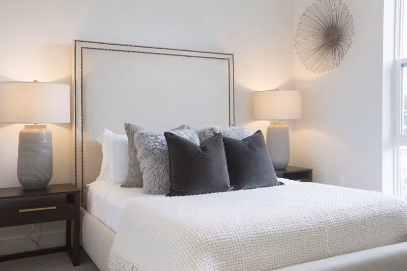 One Beachmont Apartments: Modern bedroom with stylish decor and ample natural light