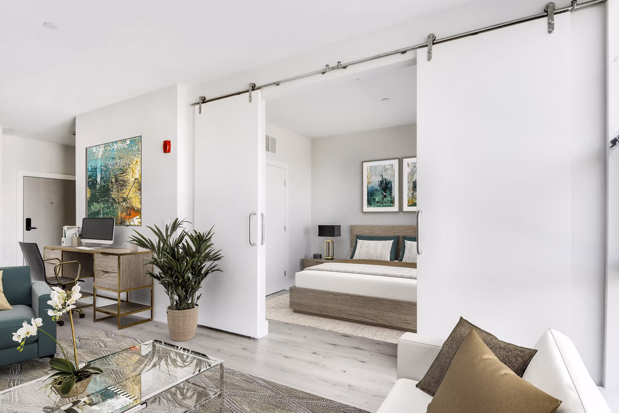 Cozy bedroom with large windows and modern decor at One Beachmont Apartments
