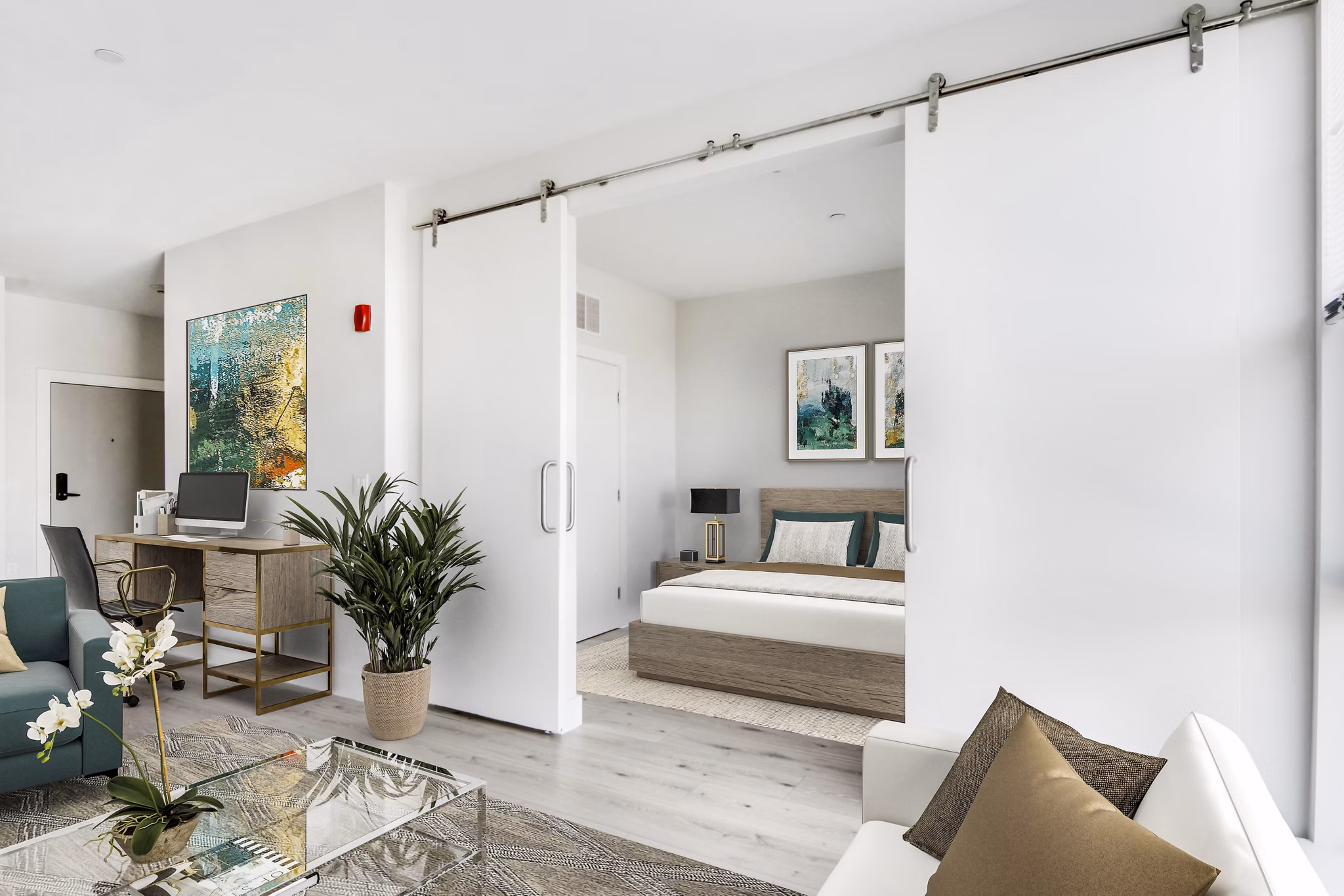 Cozy bedroom with large windows and modern decor at One Beachmont Apartments