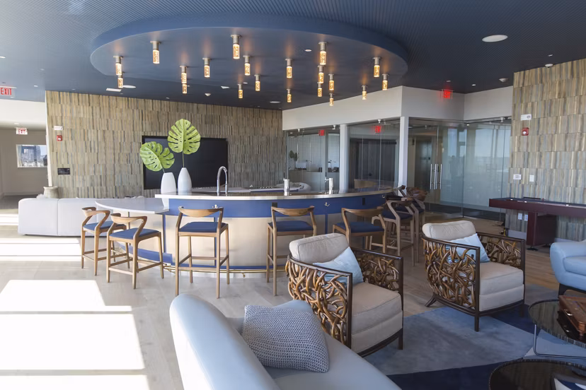 Clubhouse with modern furnishings at One Beachmont Apartments