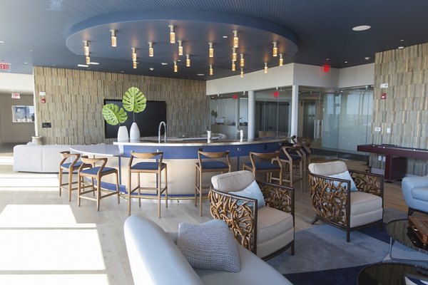 Clubhouse with modern furnishings at One Beachmont Apartments