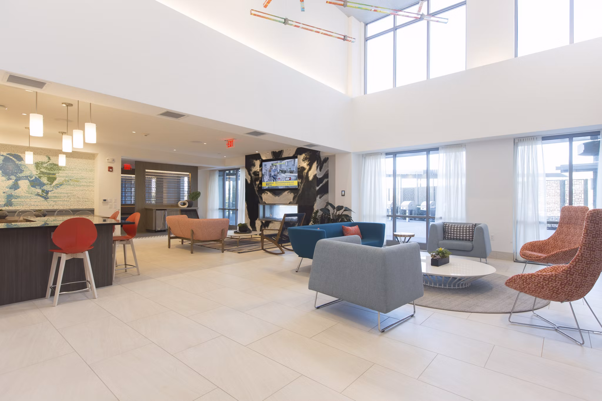 Spacious clubhouse with modern amenities at One Beachmont Apartments, ideal for social gatherings and community events