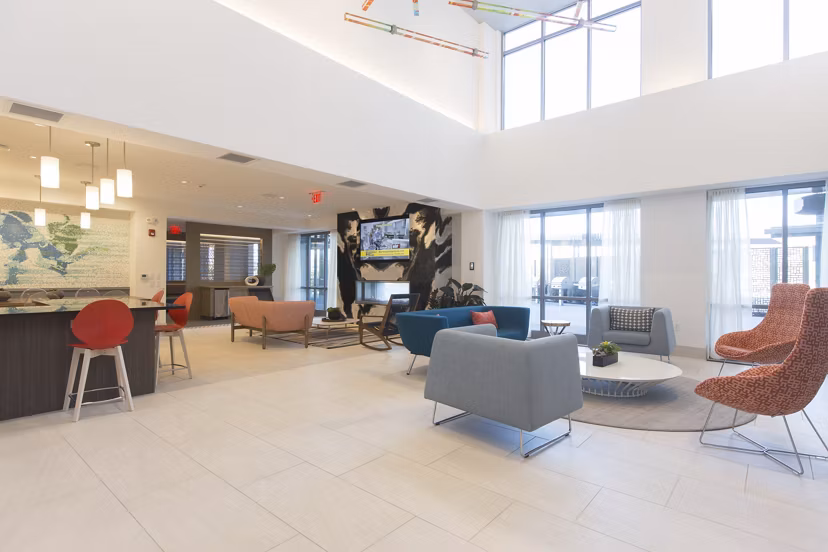 Spacious clubhouse with modern amenities at One Beachmont Apartments, ideal for social gatherings and community events