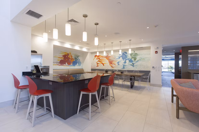 Clubhouse featuring modern design and seating at One Beachmont Apartments