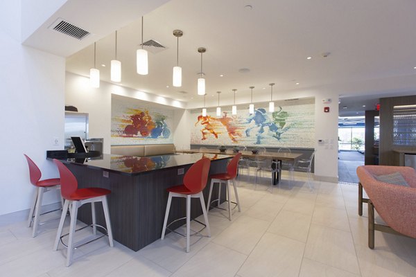 Clubhouse featuring modern design and seating at One Beachmont Apartments