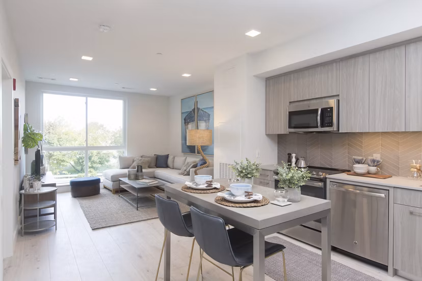 Elegant dining area with modern furnishings at One Beachmont Apartments