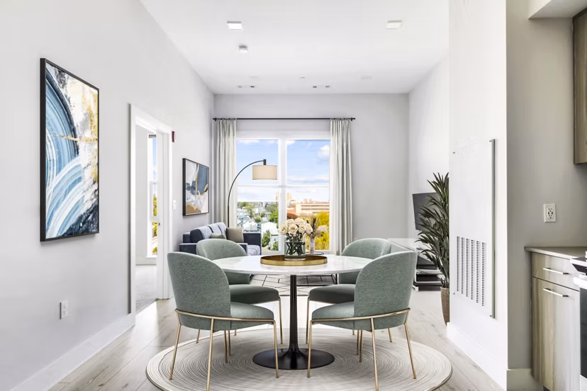 Dine in style in our elegant dining room with modern furnishings at One Beachmont Apartments