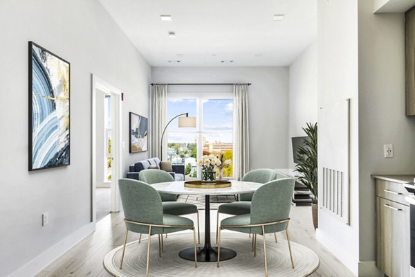 Dine in style in our elegant dining room with modern furnishings at One Beachmont Apartments