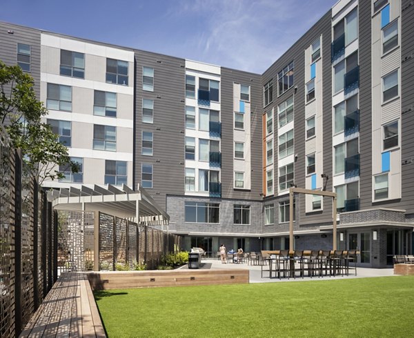 Courtyard with lush landscaping at One Beachmont Apartments offers a tranquil outdoor retreat near Boston