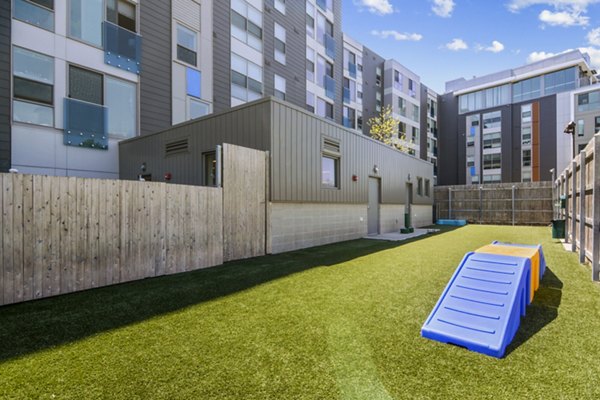 Dog park with agility equipment at One Beachmont Apartments for resident pets