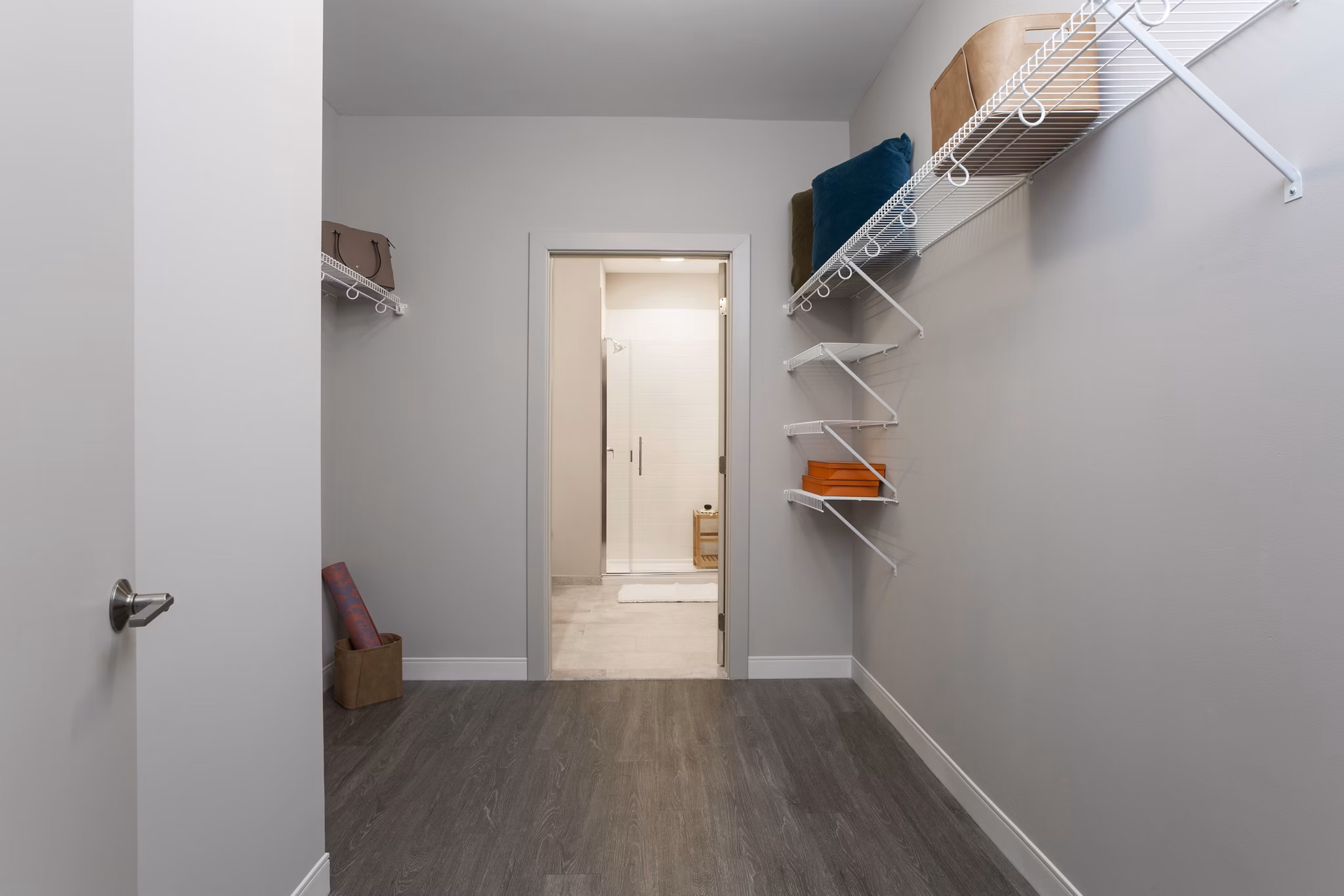 Organized closet space with ample storage options at The Andi Apartments