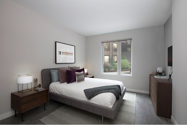 Modern bedroom with elegant decor at The Andi Apartments, a luxury property by Greystar in the heart of the city