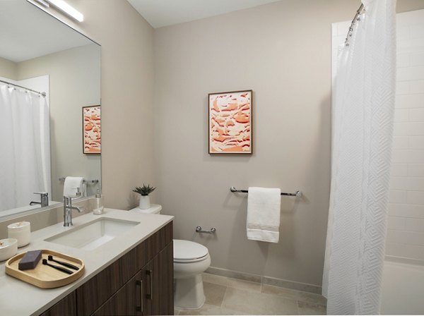 Modern bathroom with elegant fixtures at The Andi Apartments, showcasing luxury design and high-quality finishes for a refined apartment living experience