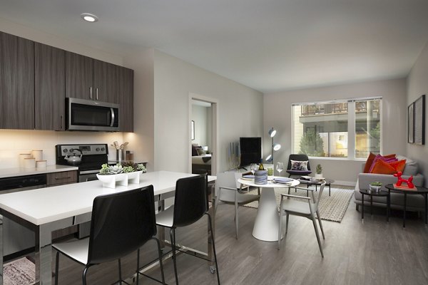 Dining area with modern decor at The Andi Apartments