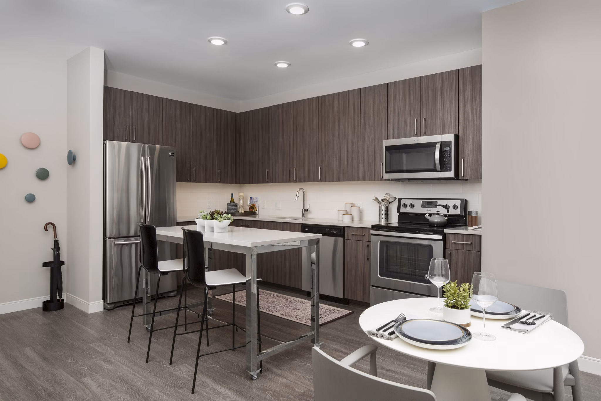 Contemporary kitchen with stainless steel appliances at The Andi Apartments, Boston's luxury living destination