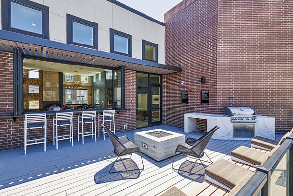 fire pit/grill area/patio at The Palmer Apartments