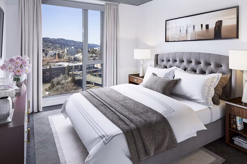 Elegant bedroom with modern decor at Indigo at Twelve West Apartments