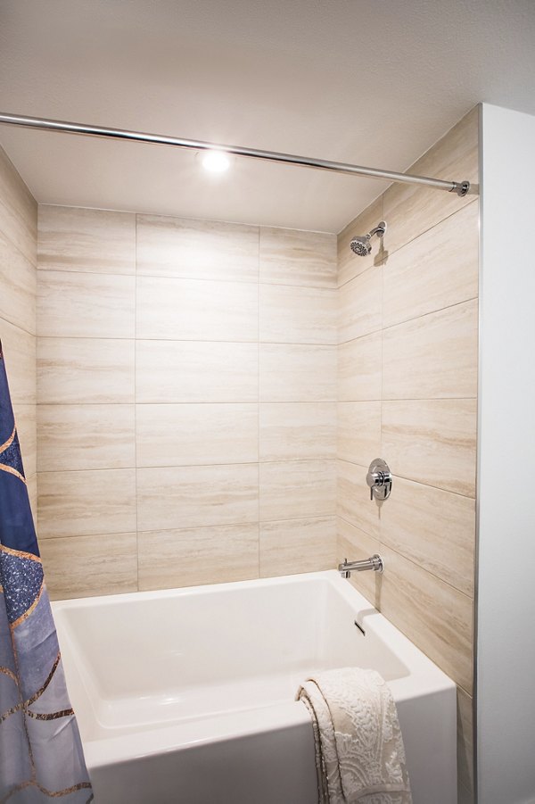 Bathroom with modern fixtures and sleek design at Fourth Street East Apartments