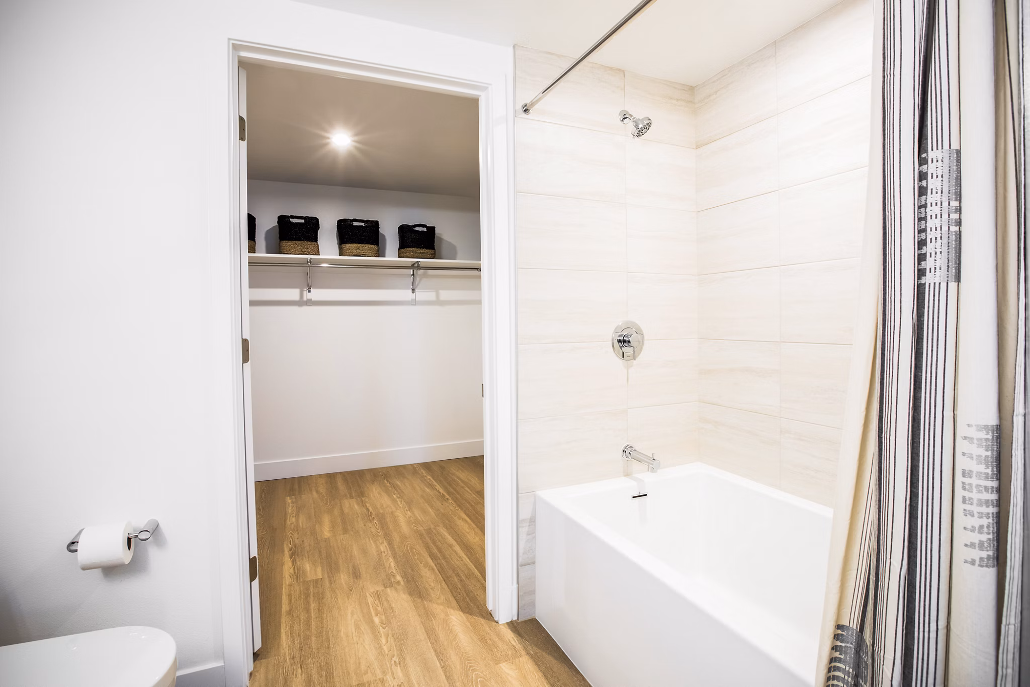 Bathroom featuring modern fixtures and elegant design at Fourth Street East Apartments