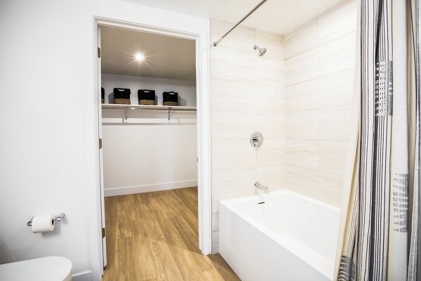 Bathroom featuring modern fixtures and elegant design at Fourth Street East Apartments