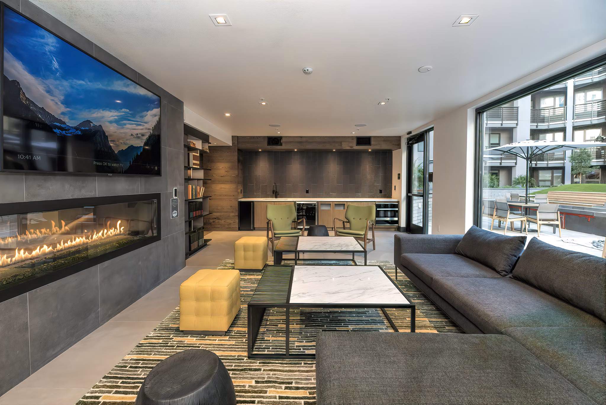 Fourth Street East Apartments: Stylish clubhouse featuring contemporary decor and ample seating
