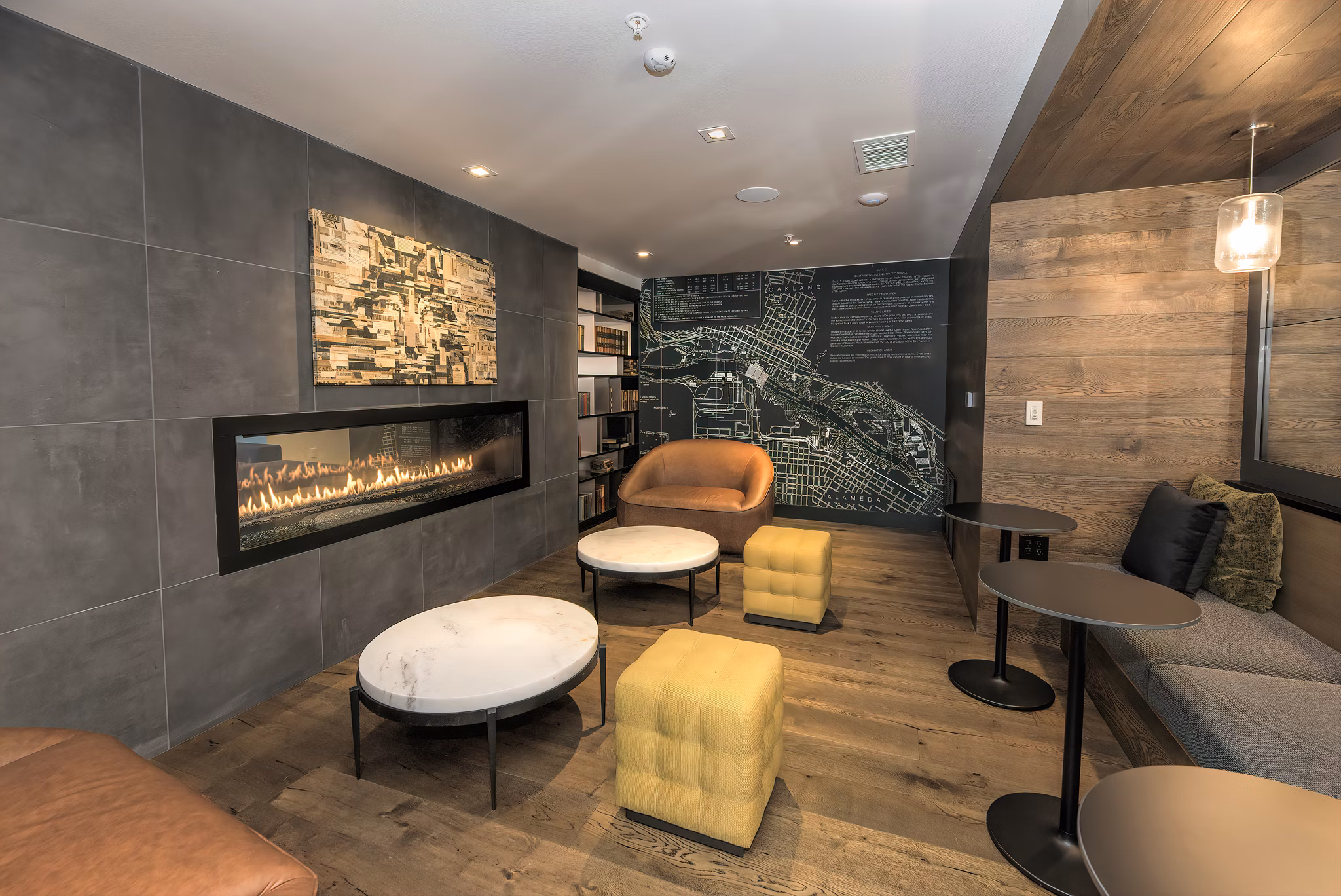 Modern clubhouse featuring open seating and vibrant decor at Fourth Street East Apartments