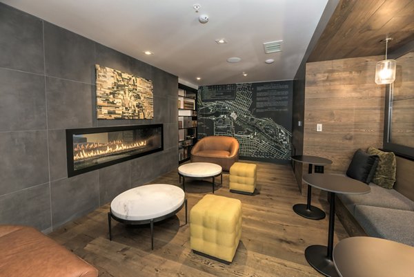 Modern clubhouse featuring open seating and vibrant decor at Fourth Street East Apartments