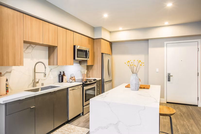Kitchen featuring sleek countertops and modern cabinetry in Fourth Street East Apartments