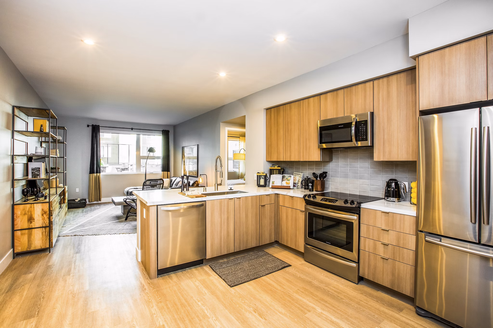Modern kitchen with sleek cabinetry and stainless steel appliances at Fourth Street East Apartments