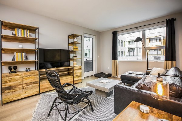 Spacious living room with modern decor at Fourth Street East Apartments
