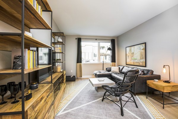 Spacious living room with modern decor at Fourth Street East Apartments