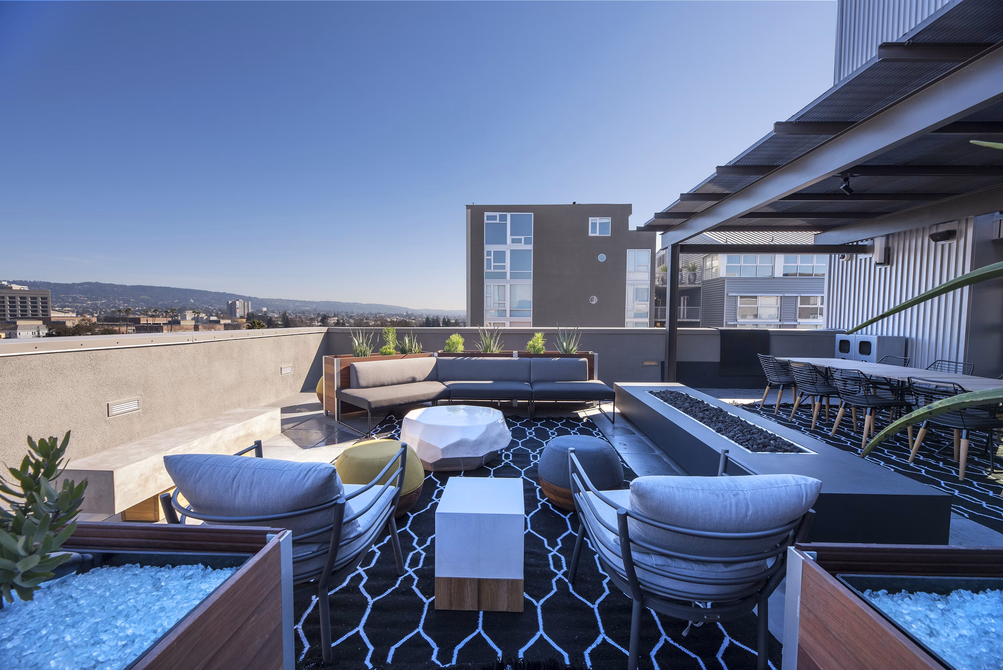 Fire pit with cozy seating area at Fourth Street East Apartments