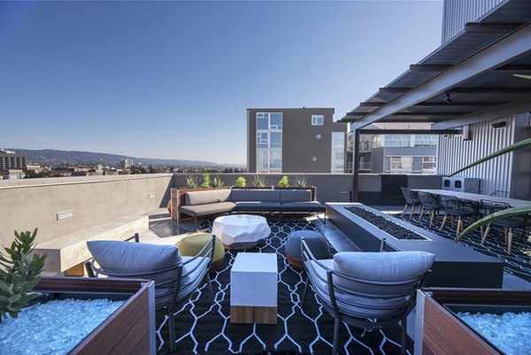 Fire pit with cozy seating area at Fourth Street East Apartments