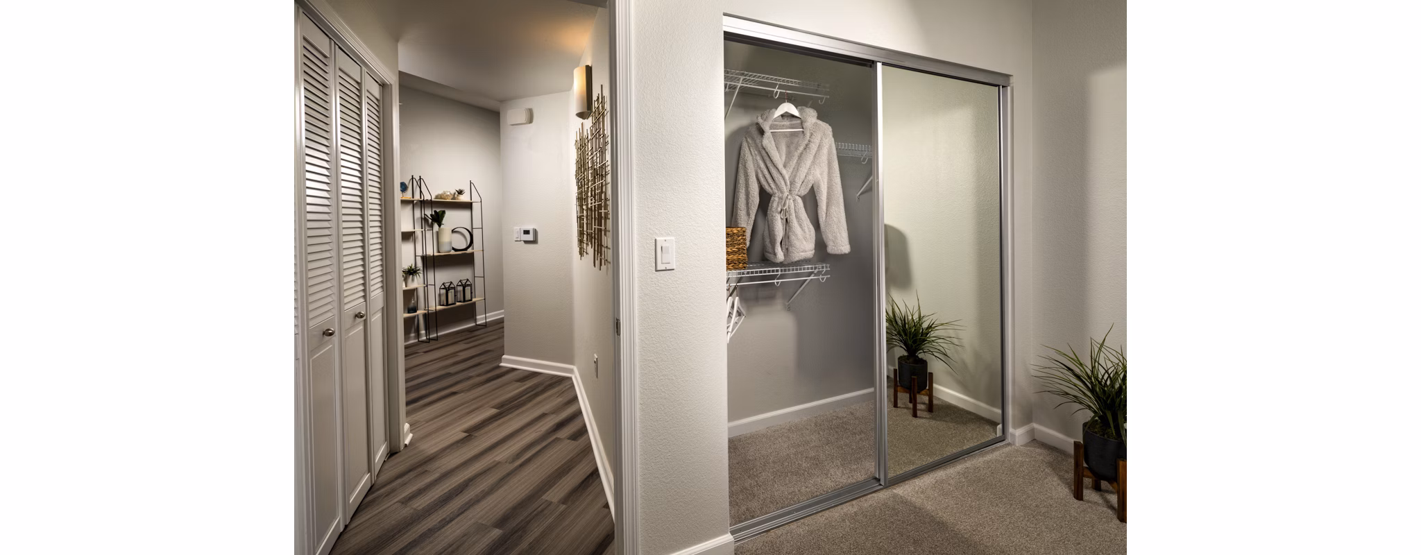 Spacious closet with modern shelving in The District Apartments, luxury living in urban setting
