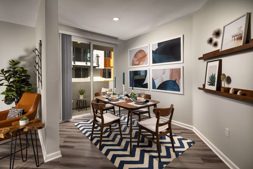 Contemporary dining area with modern furnishings at The District Apartments, a Greystar luxury community