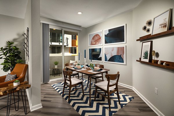 Contemporary dining area with modern furnishings at The District Apartments, a Greystar luxury community